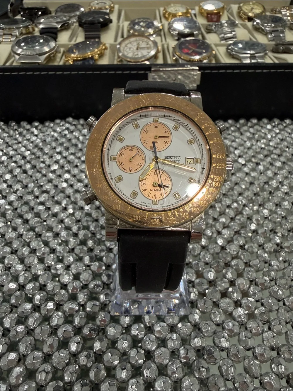 Seiko White Dial Watch with Gold-Tone Accents and Black Strap